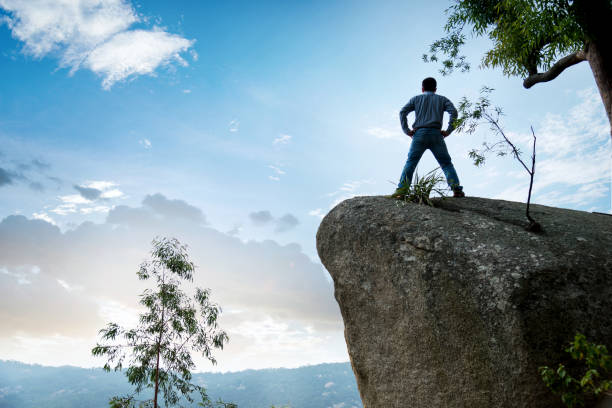 istock A man standing on the rock 1182687530