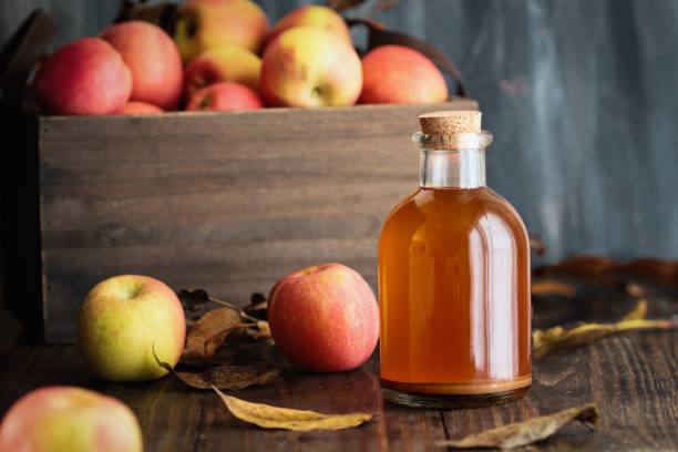 Apple Cider Vinegar with Fresh Apples stock photo