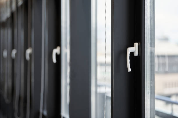 istock Windows row in office building. Modern windows with handles. Rows of windows in new apartment. 1182688549