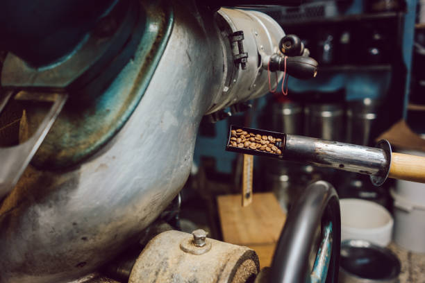 istock Sample being taken out of coffee roaster 1182688638