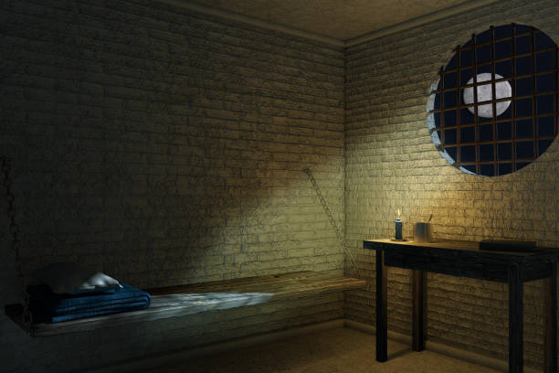istock Dark Old Prison Cell Interior for One Person with Bed and Table. 3d Rendering 1182689930