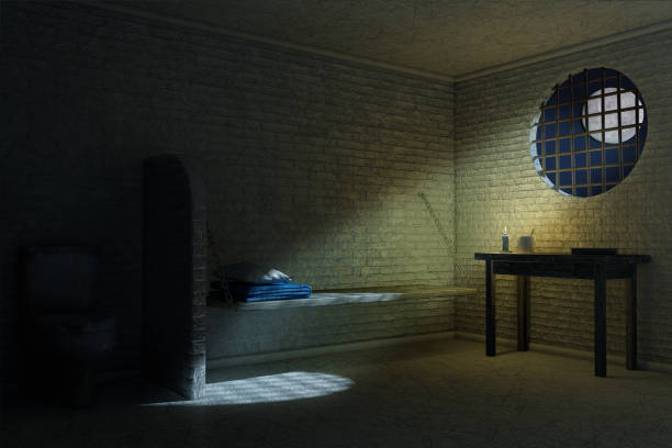 istock Dark Old Prison Cell Interior for One Person with Bed, Table, Toilet. 3d Rendering 1182689988