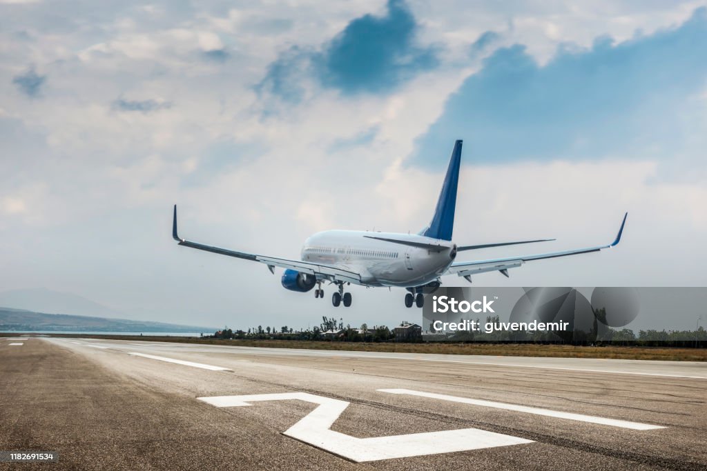 Passenger airplane landing Airplane Stock Photo