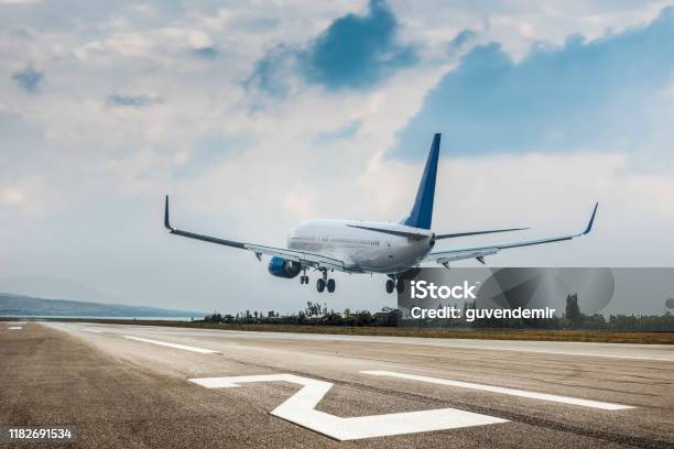 Passenger Airplane Landing Stock Photo - Download Image Now - Airplane, Airport, Landing - Touching Down