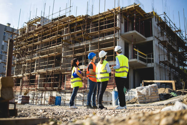 istock Group of construction workers on building site.Stock photo 1182692135