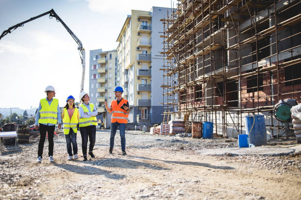 istock Group of construction workers on building site.Stock photo 1182692214