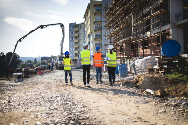 istock Group of construction workers on building site.Stock photo 1182692290