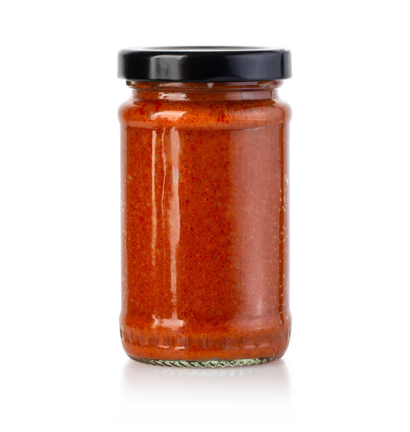 istock Tomato sauce jar on white background 1182692295