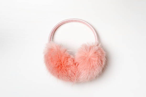 istock Warm fluffy pink ear muffs on a white background 1182692518