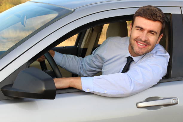 istock Stylish entrepreneur driving a car 1182697009