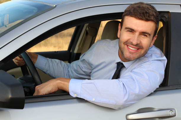 istock Stylish entrepreneur driving a car 1182697014