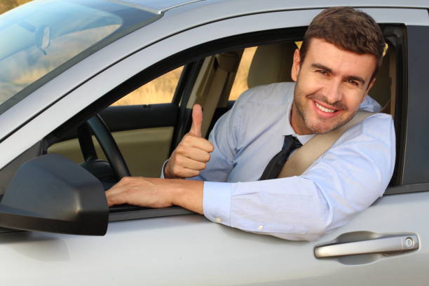 istock Successful businessman driving a new car 1182697031