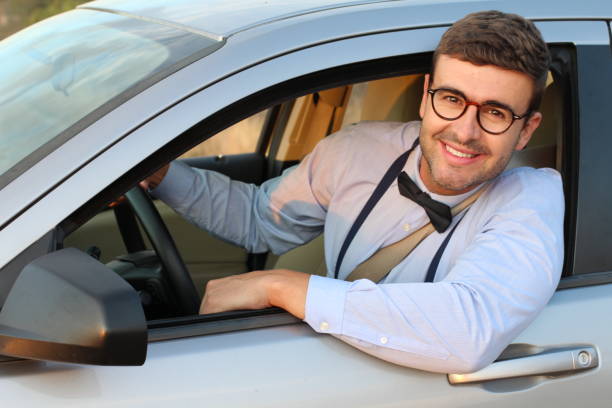 istock Classic looking male driver looking at camera 1182697172