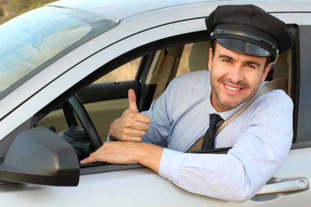 Elegant and handsome driver giving thumbs up Elegant and handsome driver giving thumbs up. domestic staff stock pictures, royalty-free photos & images