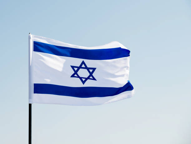 istock Israel's national flag in the wind 1182697249