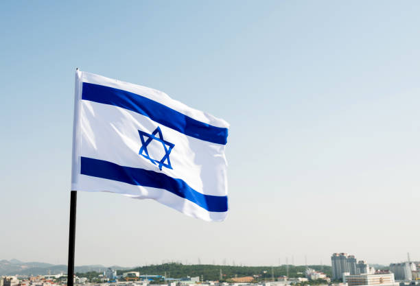 istock Israel's national flag in the wind 1182697485