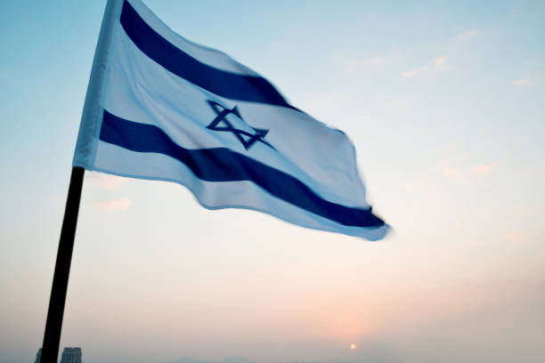 istock Israel's national flag in the wind 1182697843
