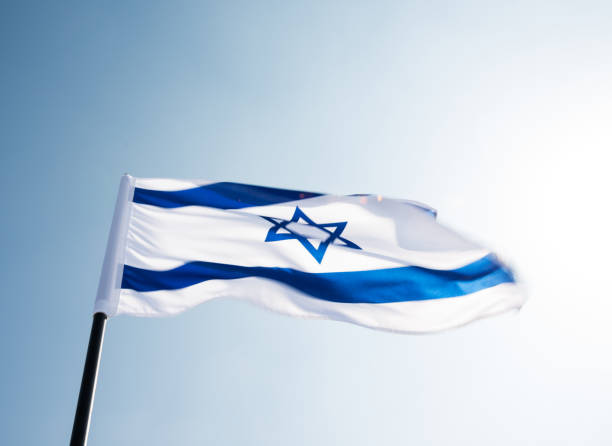 istock Israel's national flag in the wind 1182698602