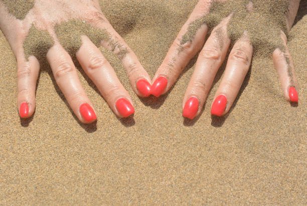 elegant hands on the sand