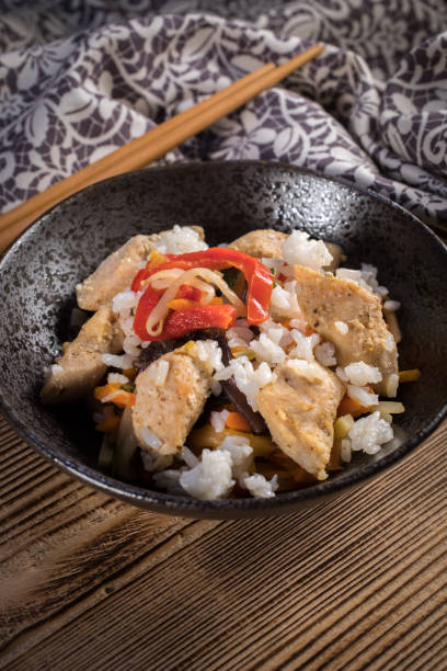 istock Fried chicken with rice and vegetables. 1182701329