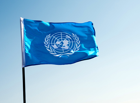 Fujian, China - November 28, 2016: United Nations flag  blowing in the wind.  The United Nations (UN) is an international organization whose stated aims are facilitating cooperation in international law, international security, economic development, social progress, human rights, and achievement of world peace.