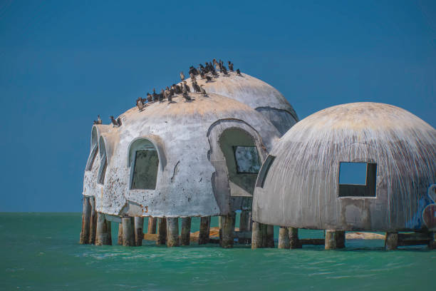 Old Dome Houses standing in the water The skeleton of old homes built with a dome roof still standing out in the water marco island stock pictures, royalty-free photos & images