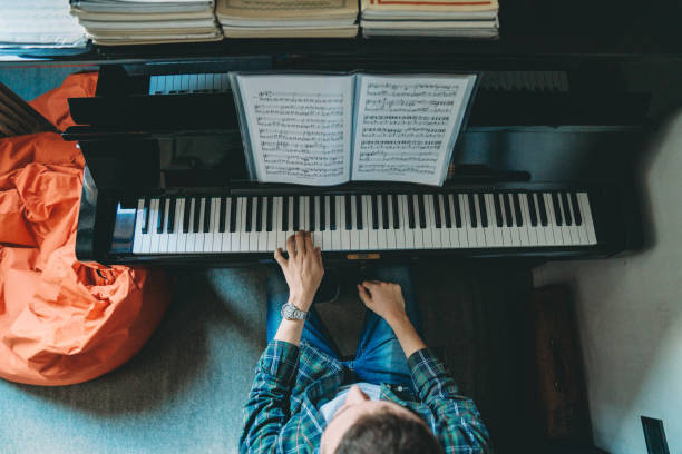 istock High angle view of a pianist playing piano 1182703537