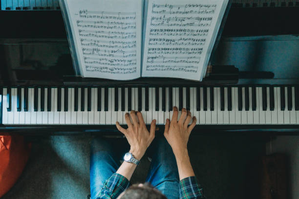 High angle view of a pianist playing piano