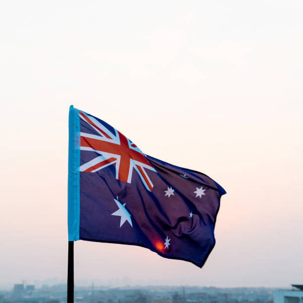 istock Australia national flag at sunset 1182705380