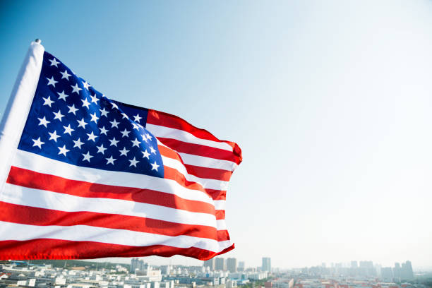 istock Waving American flag and building 1182705456