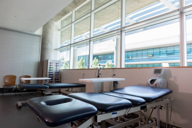 istock Modern, clean, physical therapy room with equipment and natural light 1182706342