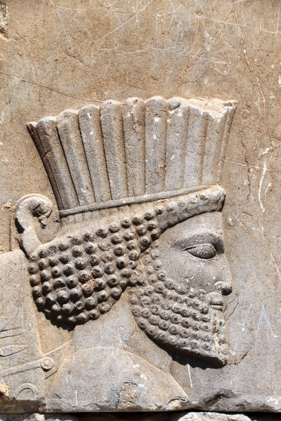 Bas-relief with assyrian warrior, Persepolis, Iran Bas-relief with face of assyrian warrior on ancient wall, Persepolis, Iran. UNESCO world heritage site persian empire stock pictures, royalty-free photos & images