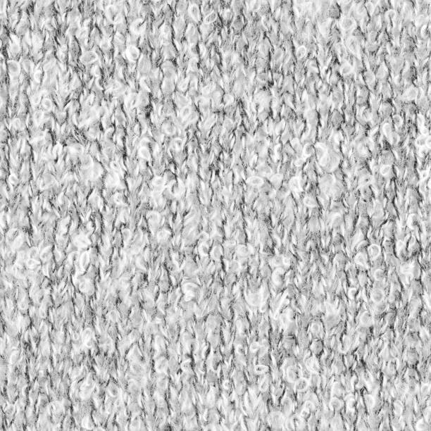 istock Booklet texture. Light knitted woolen fabric melange background. 1182711066