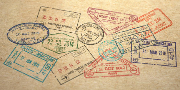 istock Background from different visa stamps on craft paper, 1182712502