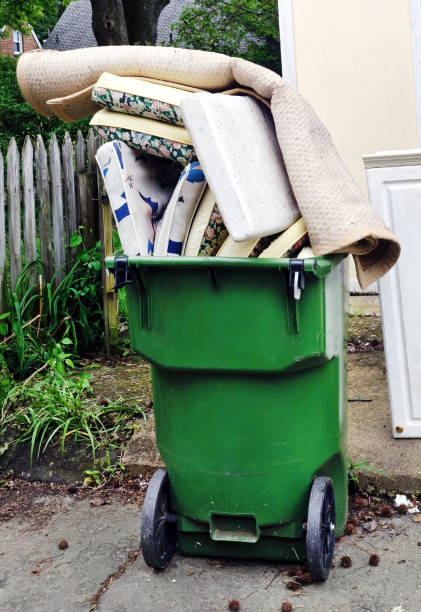 istock Rugs and Bedding in Trash Can 1182712660