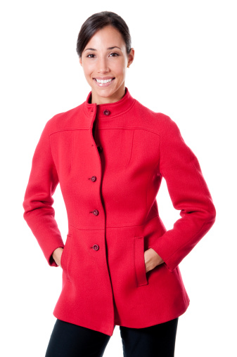 Young confident female executive in red jacket. Shot on white background.