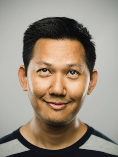 istock Real malaysian man with happy expression looking up 1182717151