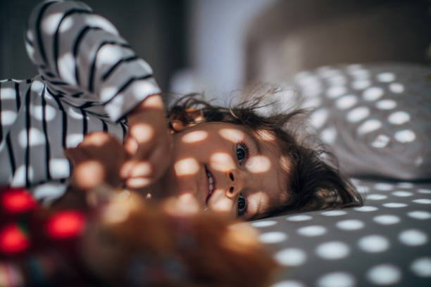 istock Adorable girl waking up 1182717163