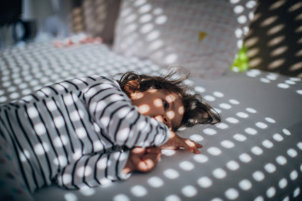 istock Adorable girl waking up 1182717248