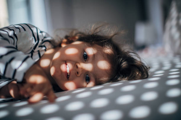 istock Adorable girl waking up 1182717273