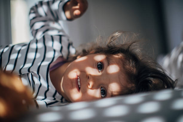 istock Adorable girl waking up 1182717404