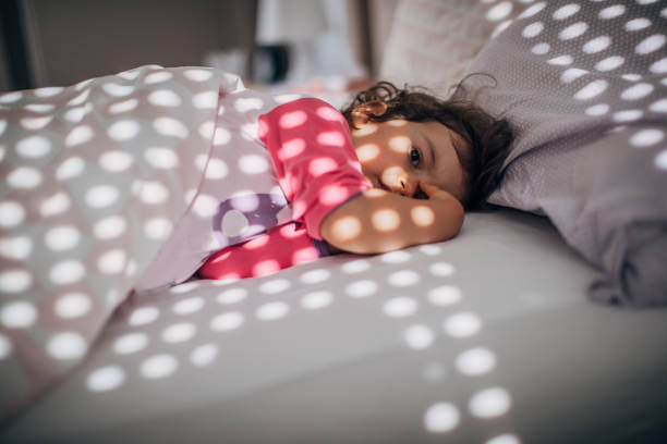 istock Cute little girl waking up 1182718170