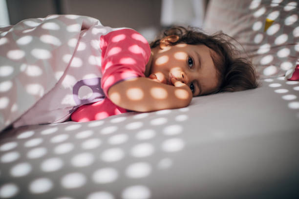 istock Cute little girl waking up 1182718190