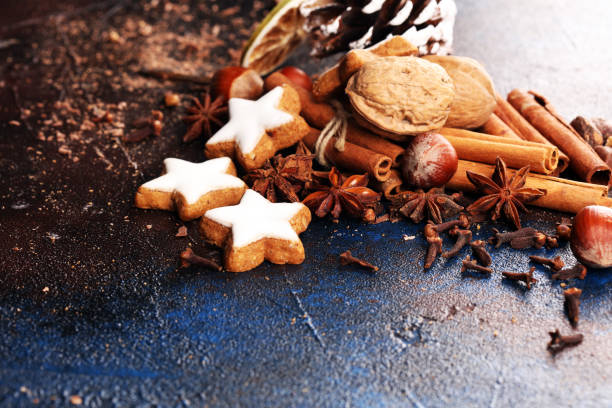 istock Baking christmas cookies. Typical cinnamon stars bakery with spices. xmas decoration on table 1182718332