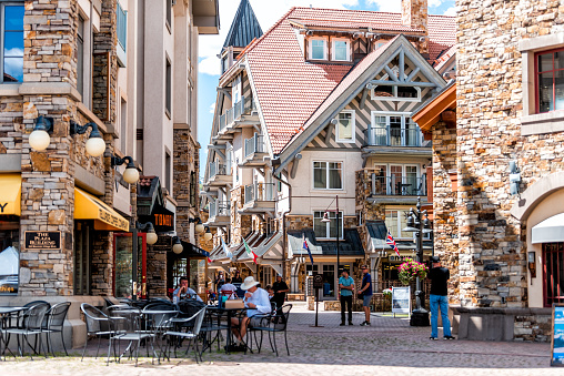 Telluride, USA - August 14, 2019: Small town Mountain Village in Colorado with street heritage plaza and stone buildings architecture on summer day