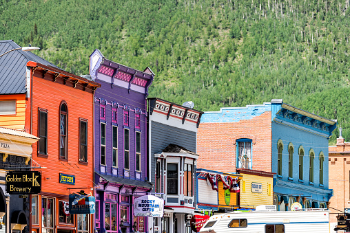 Silverton, USA - August 14, 2019: Small town in Colorado with city main street and colorful vibrant multicolored historic architecture houses buildings