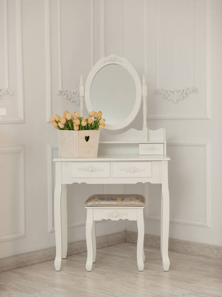 istock White room with mirror, table and chair. 1182720123