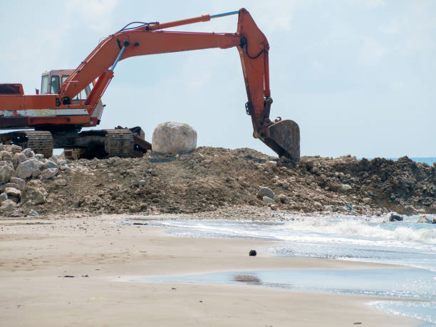 istock Old excavator, sea backround 1182721094