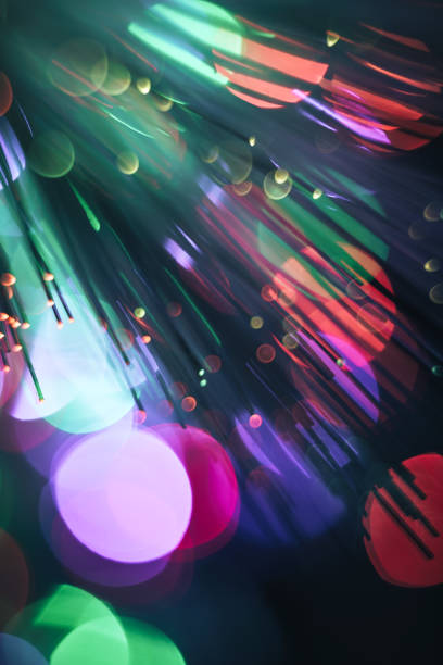 istock Beautiful multi colored optical abstract light bokeh on a dark background. 1182721223