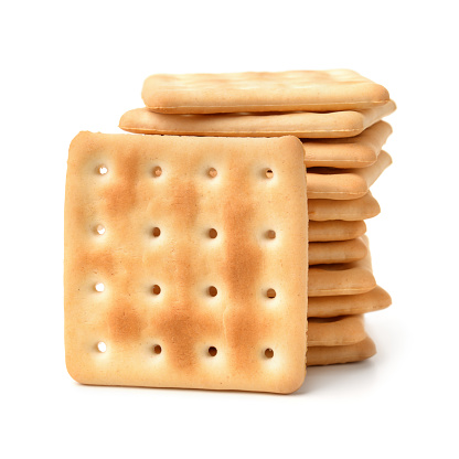 Stack of  soda crackers isolated on white